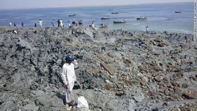 People gather on an island on Wednesday, September 25, that appeared off the coast of Gwadar after the earthquake.