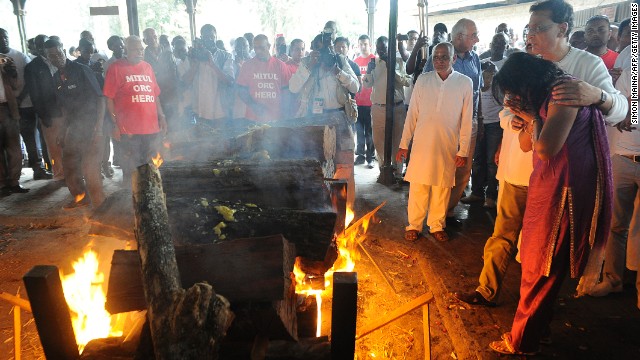 Family members light a funeral pyre at the Sikh funeral of Mitul Shah, the president of a football team in Kenya, in Nairobi on September 26.