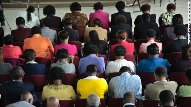 Kenyan mourners attend a prayer service held for Mbugua Mwangi, President Uhuru Kenyatta's nephew, and his fiancee, Rosemary Wahito, at St. Andrews Church in Nairobi on September 26.