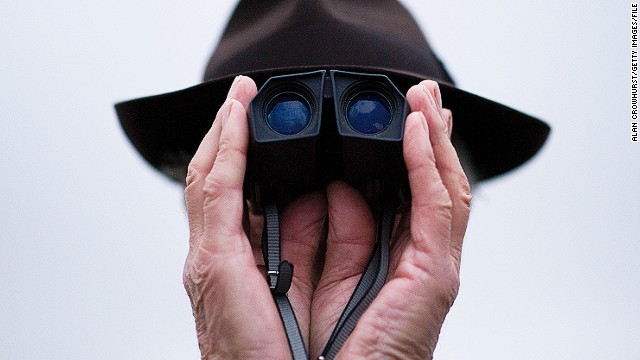 Cheltenham, Gloucestershire, UK: This curious image of a racegoer at Cheltenham taken in November 2012 is one of Crowhurst's favorites. "I just happened to see him," Crowhurst says of the man whose head is all but invisible behind his cupped hands and binoculars. 