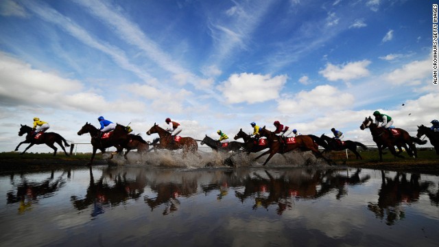 Punchestown, Ireland: Runners make their way through "Joe's Water Splash'"at Punchestown racecourse in April. 