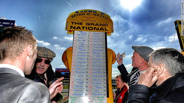 The Grand National, Aintree, Liverpool, UK: A bookmaker taking bets on the Grand National in April. The first official running of the world's most famous handicap steeplechase took place in 1839. 