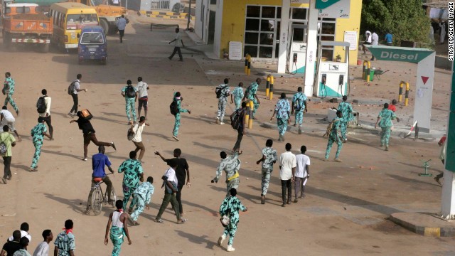 Sudanese protesters throw stones at a gas station in Khartoum's twin city of Omdurman on Wednesday. Sudan is among the countries where political violence continues to increase, Maplecroft said.