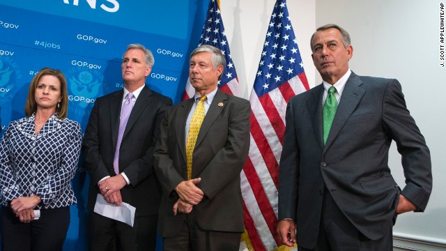 House Speaker John Boehner, right, and House GOP leaders attend a news briefing Thursday about a government shutdown.
