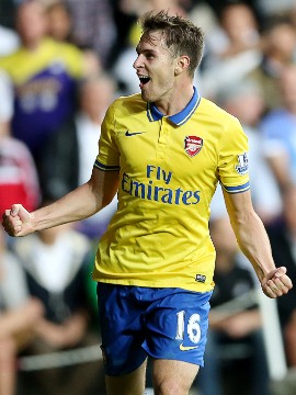 Aaron Ramsey celebrates scoring Arsenal's winner against Swansea City on Saturday evening. The victory puts the Gunners two points clear at the top of the English Premier League. 