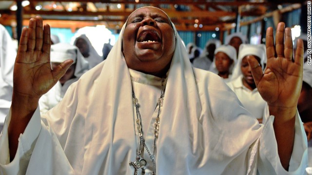 A woman shouts during a special prayer at the Legio Maria African Mission church in Nairobi, Kenya, on Sunday, September 29, for the victims of the Westgate Shopping Mall shooting.