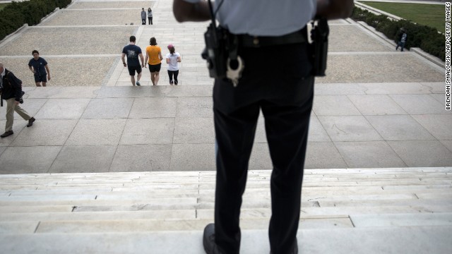 A U.S. park service police officer stands guard at the entrance of the closed Lincoln Memorial on October 1.