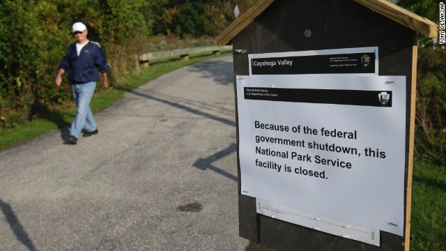 A man walks past a sign noting the closure at the Cuyahoga Valley National Park in Valley View, Ohio, on October 1.