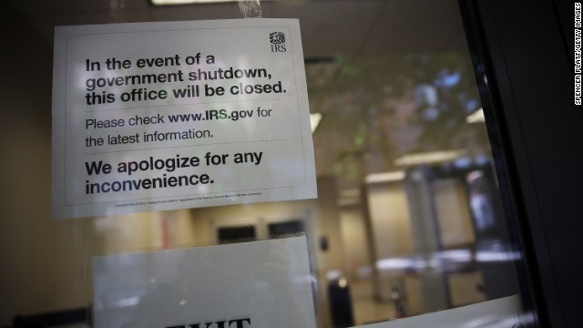 A sign is posted in the window of an IRS office in Brooklyn notifying that the office is closed due to the government shutdown on October 1.