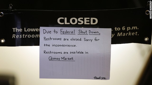 A hand-written sign informs visitors to Faneuil Hall, the nation's oldest public meeting hall, that restrooms are closed as a result of the partial government shutdown in Boston, on October 1.