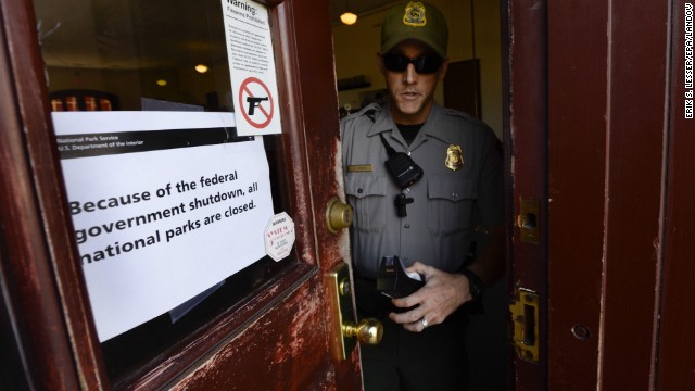 A National Park Service ranger finishes putting up a sign indicating all facilities at the Martin Luther King Historic Site are closed to the public in Atlanta, on October 1.