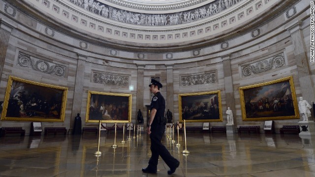 A Capitol police officer walks through the empty Capitol Rotunda, closed to tours during the government shutdown on Capitol Hill in Washington, on October 1. 