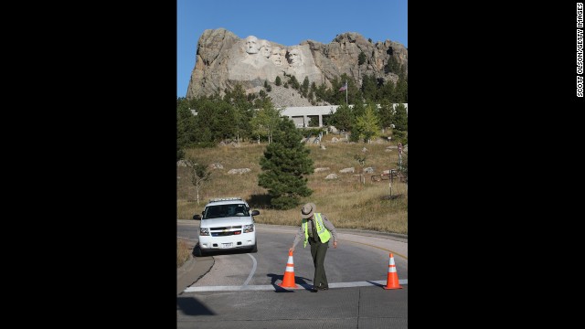 A park ranger secures a road at the entrance to the Mount Rushmore National Memorial on October 1 in Keystone, South Dakota.