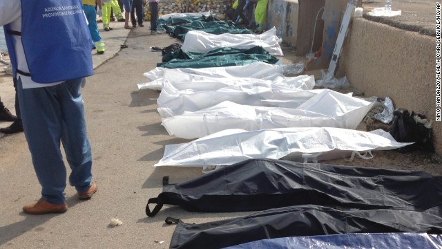 Bodies of drowned migrants are lined up at the port of Lampedusa on October 3.