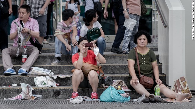 China's National Tourism Administration publicized a 64-page "Guidebook for Civilized Tourism" on its website ahead of the Golden Week public holiday that started on October 1, the same day the country's new tourism law came into effect. Golden Week is one of the most popular times of year for the Chinese to travel. Here, tourists visit a waterfront promenade in Hong Kong.