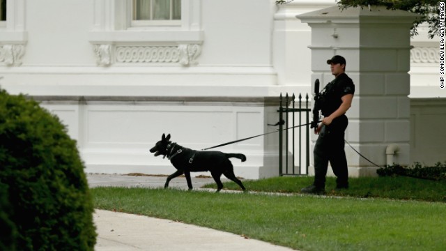 A member of the U.S. Secret Service counter-assault team patrols the grounds of the White House October 3 in Washington.