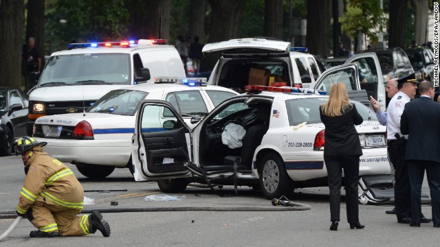 A damaged U.S. Capitol Police car is seen after the car chase and reported shooting incident.