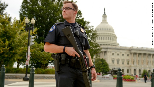 A U.S. Capitol Police Officer stands guard in front of the Capitol.