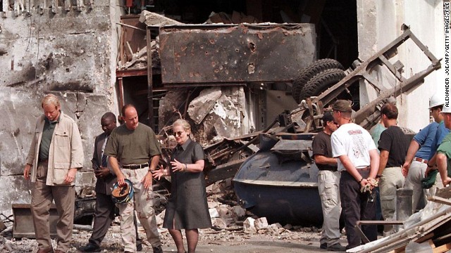 The Tanzania blast went off nearly simultaneously, to the one in Kenya on August 7, 1998, leaving 11 people dead. Here, U.S. Secretary of State Madeleine Albright talks with a member of the FBI at the U.S. Embassy in Dar es Salaam on August 18, 1998. Visible in the background is the tanker that was used to create the explosion. 
