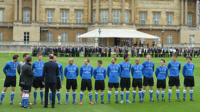 Prince William talks to the players ahead of the special match at Buckingham Palace to mark the 150th anniversary of the English FA. 