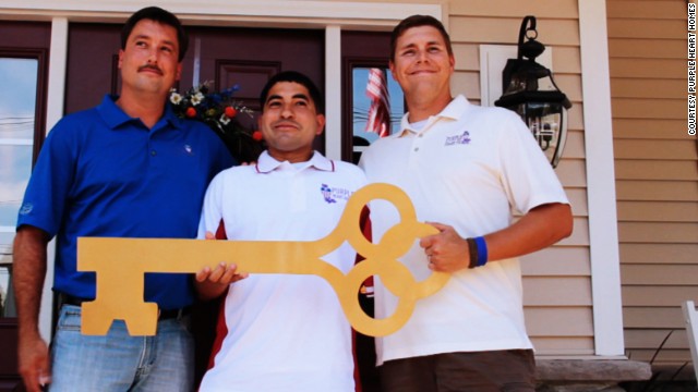 After Dale Beatty, right, lost his legs in the Iraq war, his community thanked him for his service by helping him build a home. To pay it forward, Beatty co-founded Purple Heart Homes, which has helped build or modify homes for dozens of disabled U.S. veterans. "We wouldn't leave someone behind on the battlefield," Beatty said. "Why would we do it at home?"