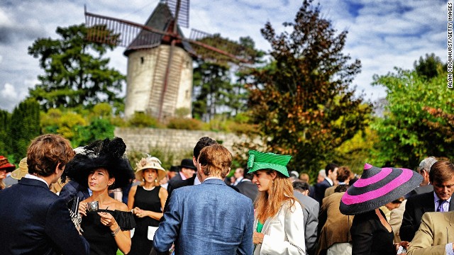 As Crowhurst's images reveal, a race meeting is as much about the drama off the track as it is on it. The photographer was at Longchamp in Paris for the Prix de l'Arc de Triomphe -- European racing's richest prize -- on Sunday to capture the windmills and hats as well as the racing.