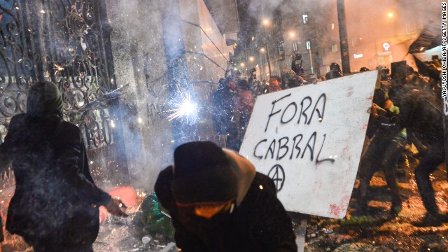 Masked protesters attempted to destroy a gate of the Rio de Janeiro City Hall on October 7.