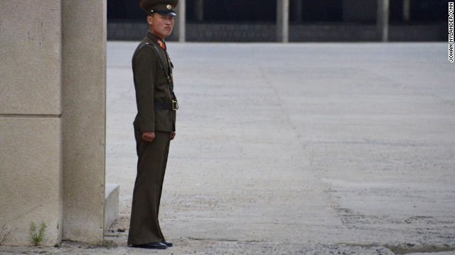 A stern looking North Korean guard by the Chinese border customs office. This image was deleted by North Korean officials. 