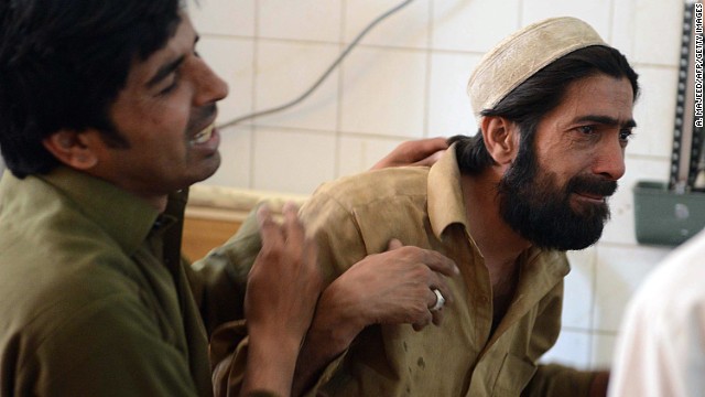 Pakistani relatives mourn the killing of a female polio health worker at a hospital following an attack by gunmen in Peshawar on May 28, 2013.