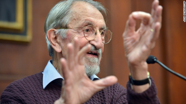 Martin Karplus describes molecular behavior as he speaks to reporters at Harvard University in Cambridge, Massachusetts, after being awarded the Nobel Prize in chemistry on October 9. The three men's work allows researchers to study chemical reactions, which take place very quickly, at a slower pace using a computer. 