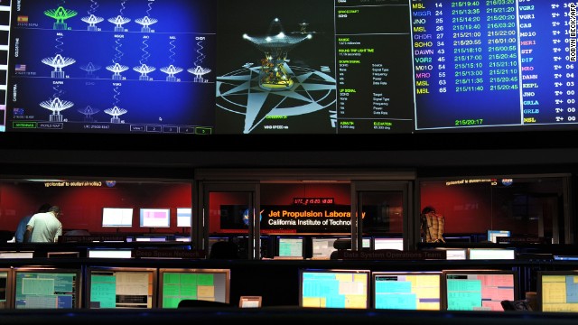 Mars Science Laboratory (MSL) mission members work in the data processing room in Pasadena, California, August 2, 2012.