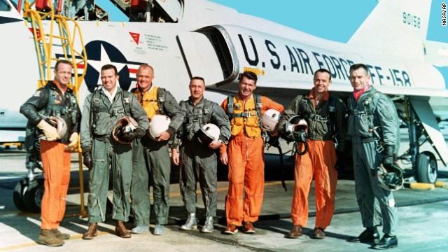 The original seven Mercury astronauts are shown in their flight suits during training at NASA Langley Research Center in March 1961. From left: Lt. Carpenter, Capt. Gordon Cooper, Col. John H. Glenn Jr., Capt. Virgil "Gus" Grissom, Lt. Cmdr. Walter Schirra, Lt. Cmdr. Alan B. Shepard Jr. and Capt. Donald K. "Deke" Slayton. 