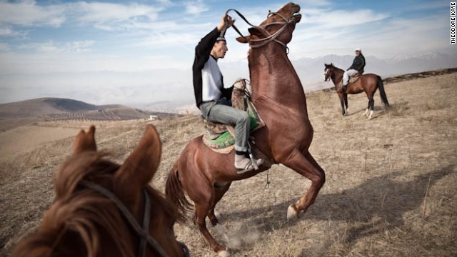 Suhrob exercises one of the horses in preparation for Buzkashi -- a Central Asian sport where up to a hundred or more riders fight to seize a headless goat carcass then carry it to a goal. As is common in the buzkashi world, rather than riding their own horses, Suhrob and his brothers ride animals owned by a wealthy individual.