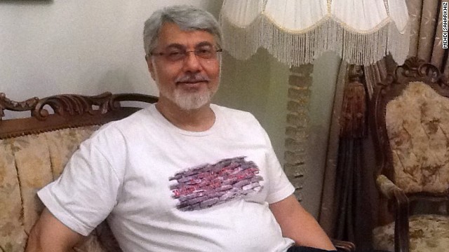 Isa Saharkhiz pictured after his release from prison in Iran in October 2013 and following more than four years behind bars.
