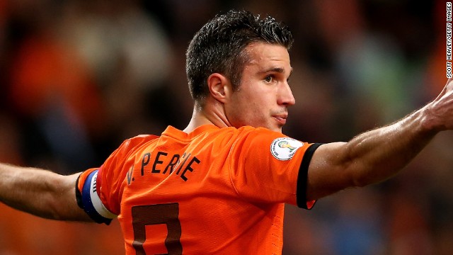 Robin van Persie scored a hat-trick in an 8-1 thrashing of Hungary by his Dutch team who have topped Group D. 
