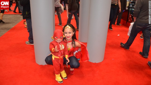 The Flash (looking more adorable than usual here) <a href='http://ireport.cnn.com/docs/DOC-1047486'>poses with Wonder Woman</a> (sometimes referred to as "Mommy").