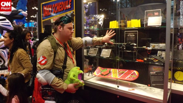 Oh, those tempting toy booths. This <a href='http://ireport.cnn.com/docs/DOC-1047657'>Ghostbuster </a>eyes an item at the Mattel booth.