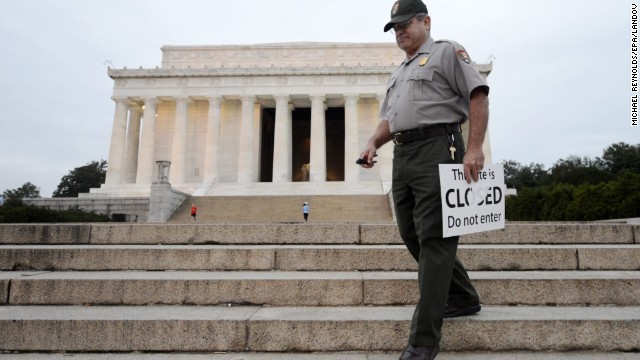 U.S. park ranger Richard Trott picks up closed signs at the Lincoln Memorial after it reopens October 17.