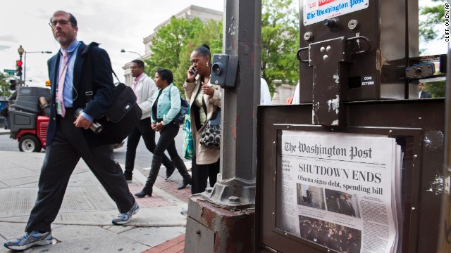 Washingtonians head to work near Pennsylvania Avenue on October 17 as federal workers return in force to their jobs after the shutdown.