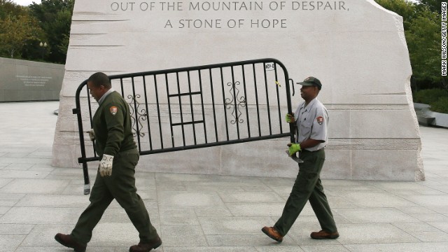 U.S. Park Service workers remove a barricade from the Martin Luther King Jr. Memorial in Washington on October 17.