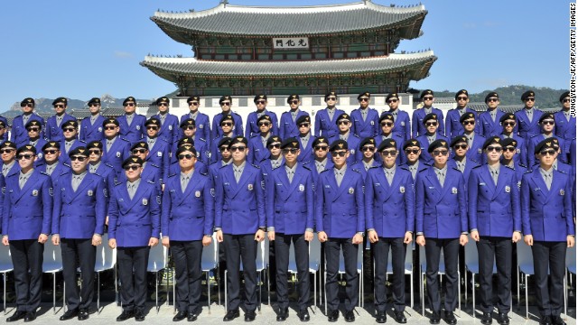 Seoul's multi-lingual tourism police force, decked out in Psy-inspired uniforms, attend their inauguration ceremony at Seoul's Gwanghwamun Square. No prizes for those who guess which song was played during the event. 