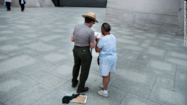 A U.S. park ranger helps a tourist at the Martin Luther King Jr. Memorial in Washington on October 17.