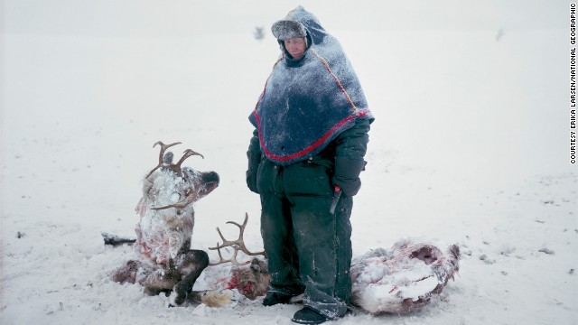 A Sami in Sweden mourns the loss of two reindeer that starved after locking horns in a fight for dominance, in this remarkable photograph by Erika Larsen.