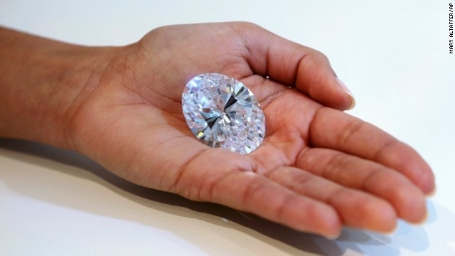 A 118-carat white diamond is on display at Sotheby's, a New York auction house, on September 4. The oval stone was auctioned off in Hong Kong on October 7 for a record $30.6 million.