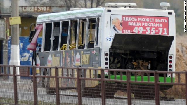 A damaged passenger bus sits on a road after an explosion in Volgograd, Russia, on Monday.