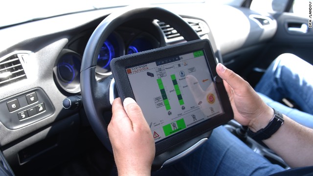 Driving instructor Horst Heider uses an iPad during a safety-training class for seniors in Boksee, Germany, on June 20, 2013.