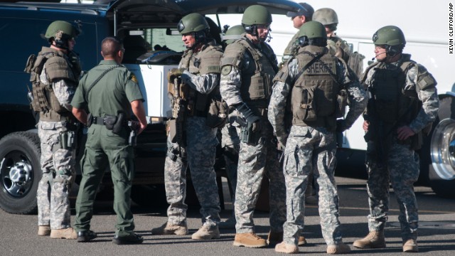 SWAT team members secure the scene near the middle school.