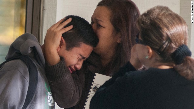 A Sparks Middle School student is comforted after being released from Agnes Risley Elementary School, where some students were evacuated to after the shooting.