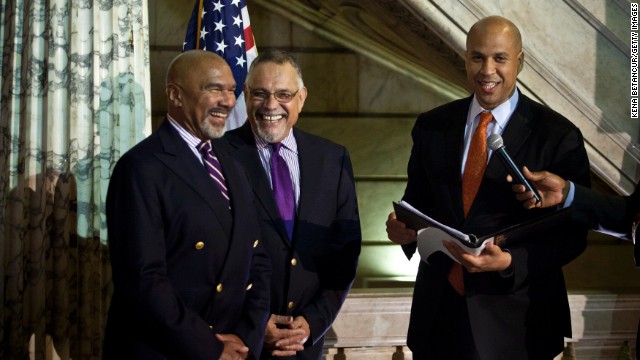 Newark, New Jersey, Mayor Cory Booker officiates a wedding ceremony for Joseph Panessidi and Orville Bell at City Hall in October 2013. The state Supreme Court denied the state's request to prevent same-sex marriages temporarily, clearing the way for same-sex couples to marry.