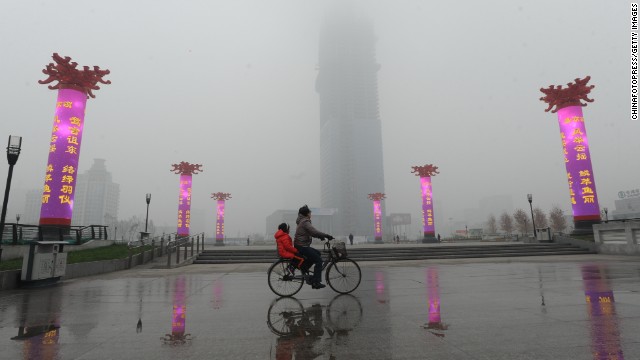 A cyclist rides along a road in Shenyang, China, on October 21. 